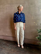 mature woman wearing designer Rachel Comey navy silk Lilo button down long sleeve contemporary heart print 