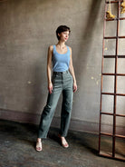 Woman wearing designer Rachel Comey Dardo green comfy stretch cotton Pant high rise pintuck front seam flattering