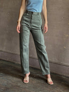 Woman wearing designer Rachel Comey Dardo green comfy stretch cotton Pant high rise pintuck front seam 