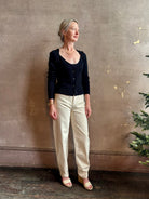 Mature woman wearing designer rachel comey Etla knit top with long sleeves sweetheart neckline in timeless black