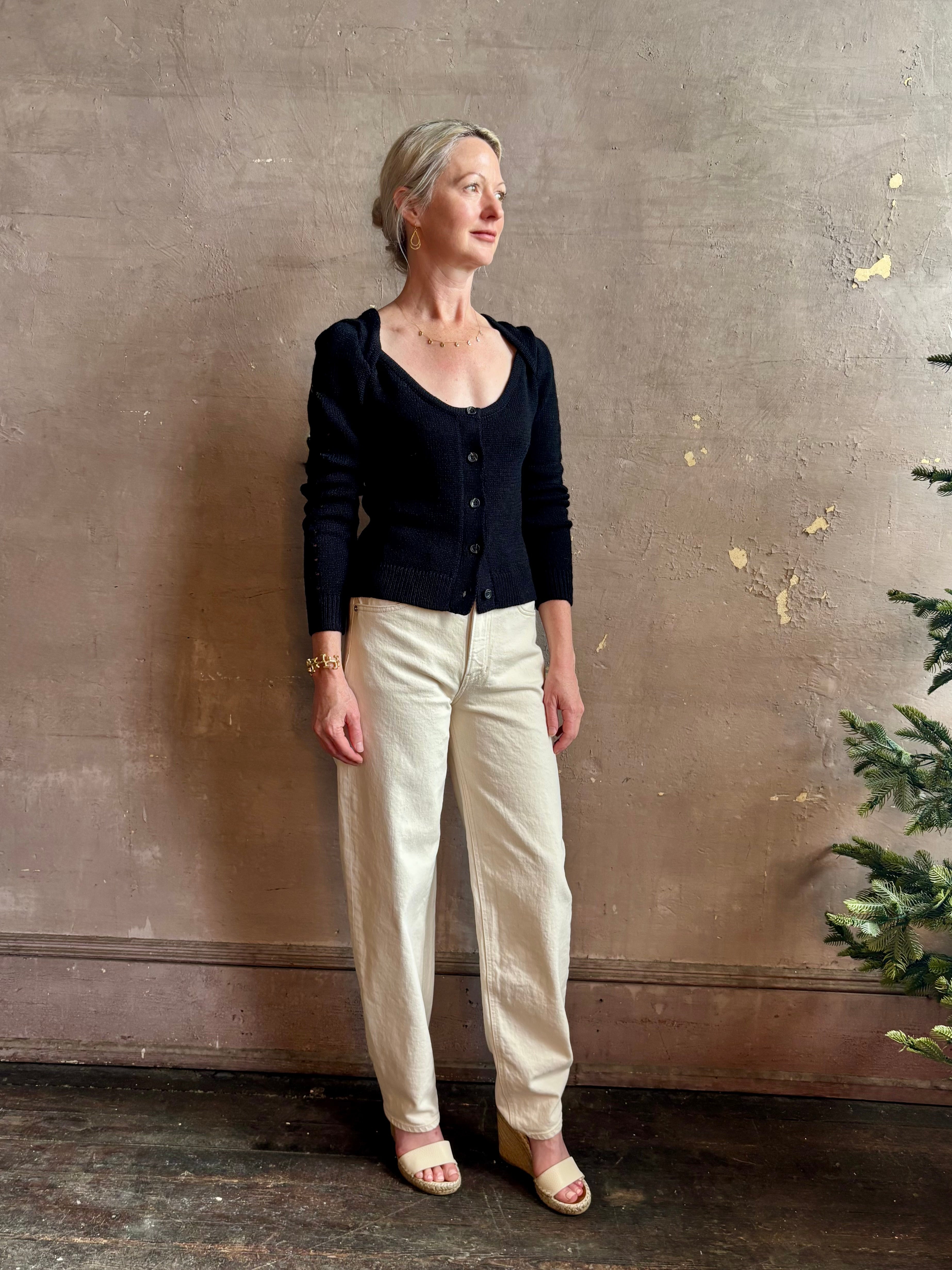 Mature woman wearing designer rachel comey Etla knit top with long sleeves sweetheart neckline in timeless black