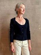 Mature woman wearing designer rachel comey Etla knit top with long sleeves sweetheart neckline in timeless black