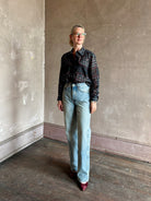 Mature woman wearing designer brand Rachel Comey long sleeve paisley print button down shirt semi-transparent