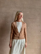 Mature woman wearing Rachel Comey long sleeve caramel cardigan leightweight plunging v-neck layering