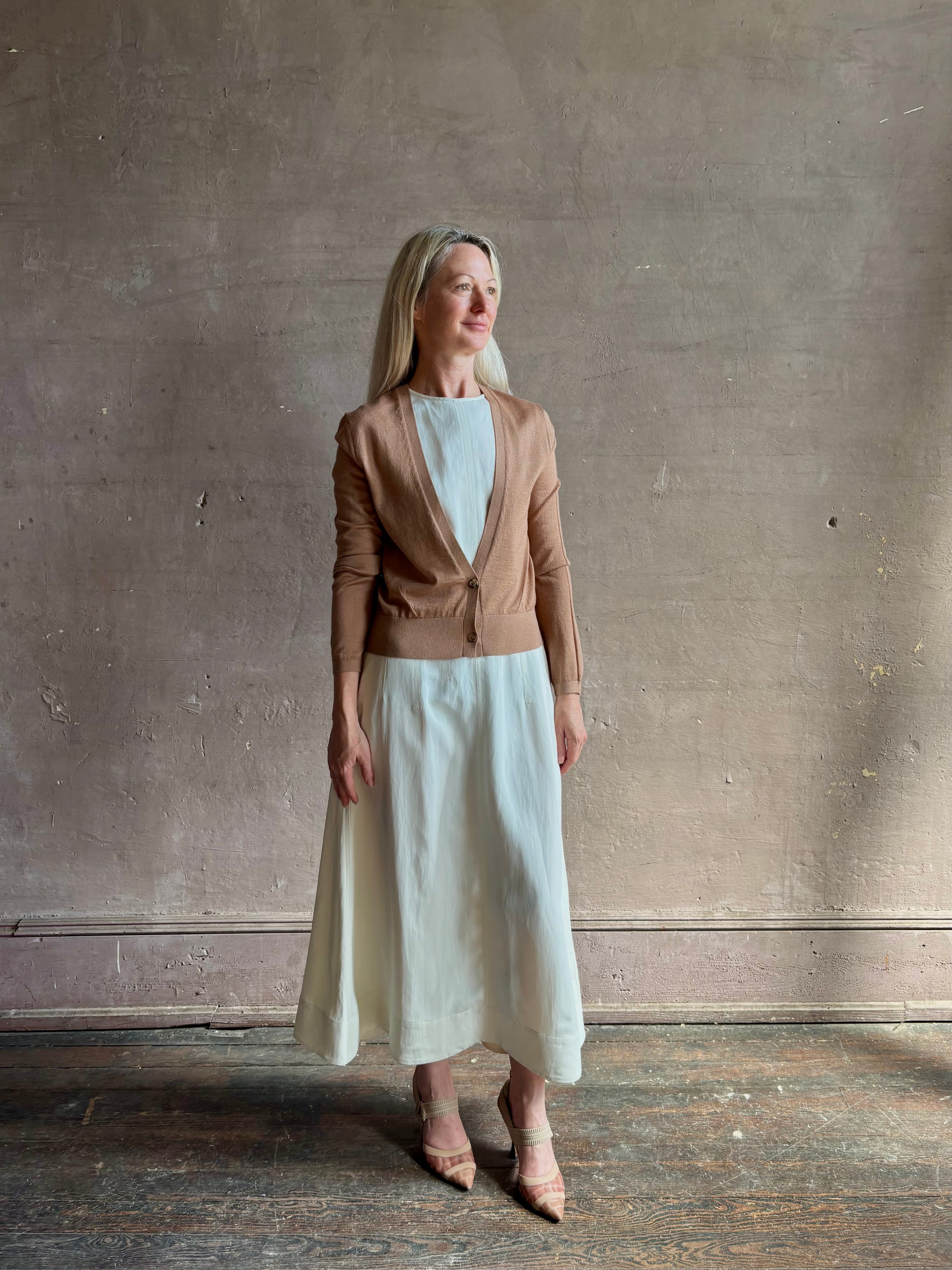 Mature woman wearing Rachel Comey long sleeve caramel cardigan leightweight plunging v-neck layering