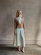 Mature woman wearing Rachel Comey long sleeve caramel cardigan leightweight plunging v-neck layering
