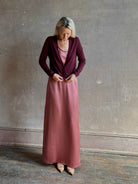 Mature woman wearing Rachel Comey long sleeve burgundy cardigan leightweight plunging v-neck layering