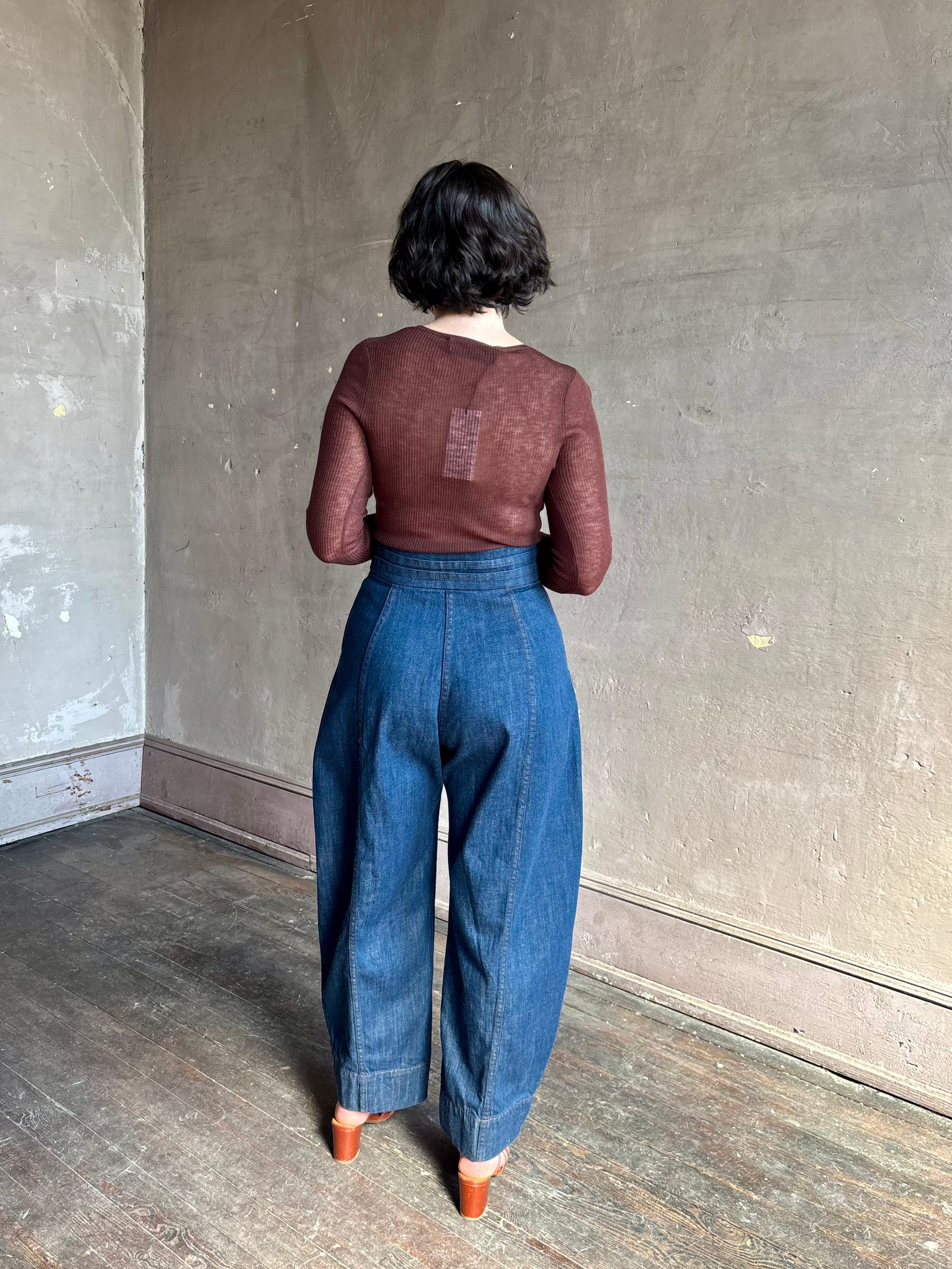 Rachel Comey sculptural high-rise dark wash denim with a built-in cummerbund-style waist barrel leg
