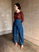 Rachel Comey sculptural high-rise dark wash denim with a built-in cummerbund-style waist barrel leg