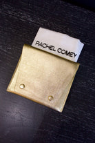 Metallic gold Rachel Comey leather wallet with two snap buttons closure