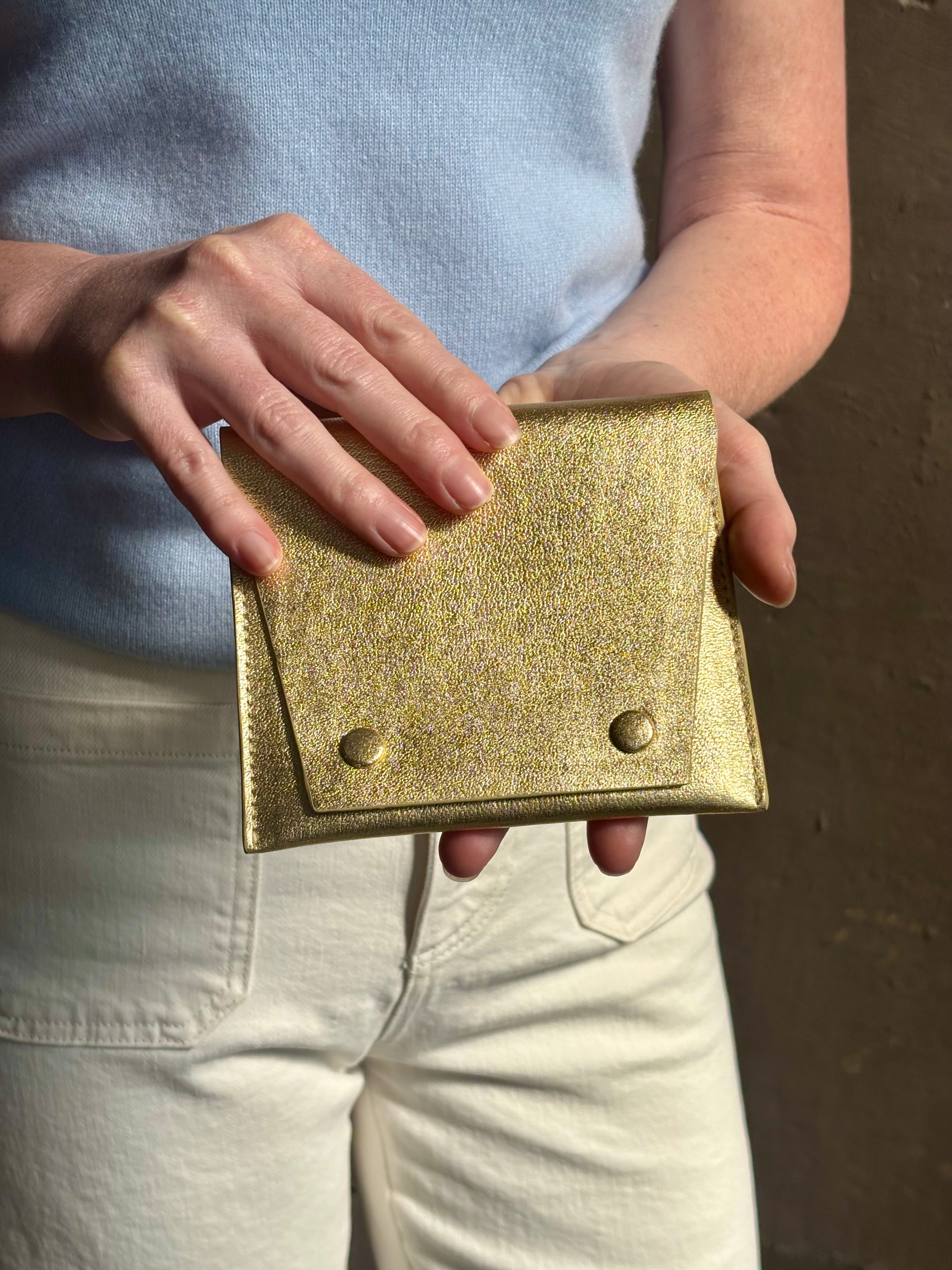 Metallic gold Rachel Comey leather wallet with two snap buttons closure
