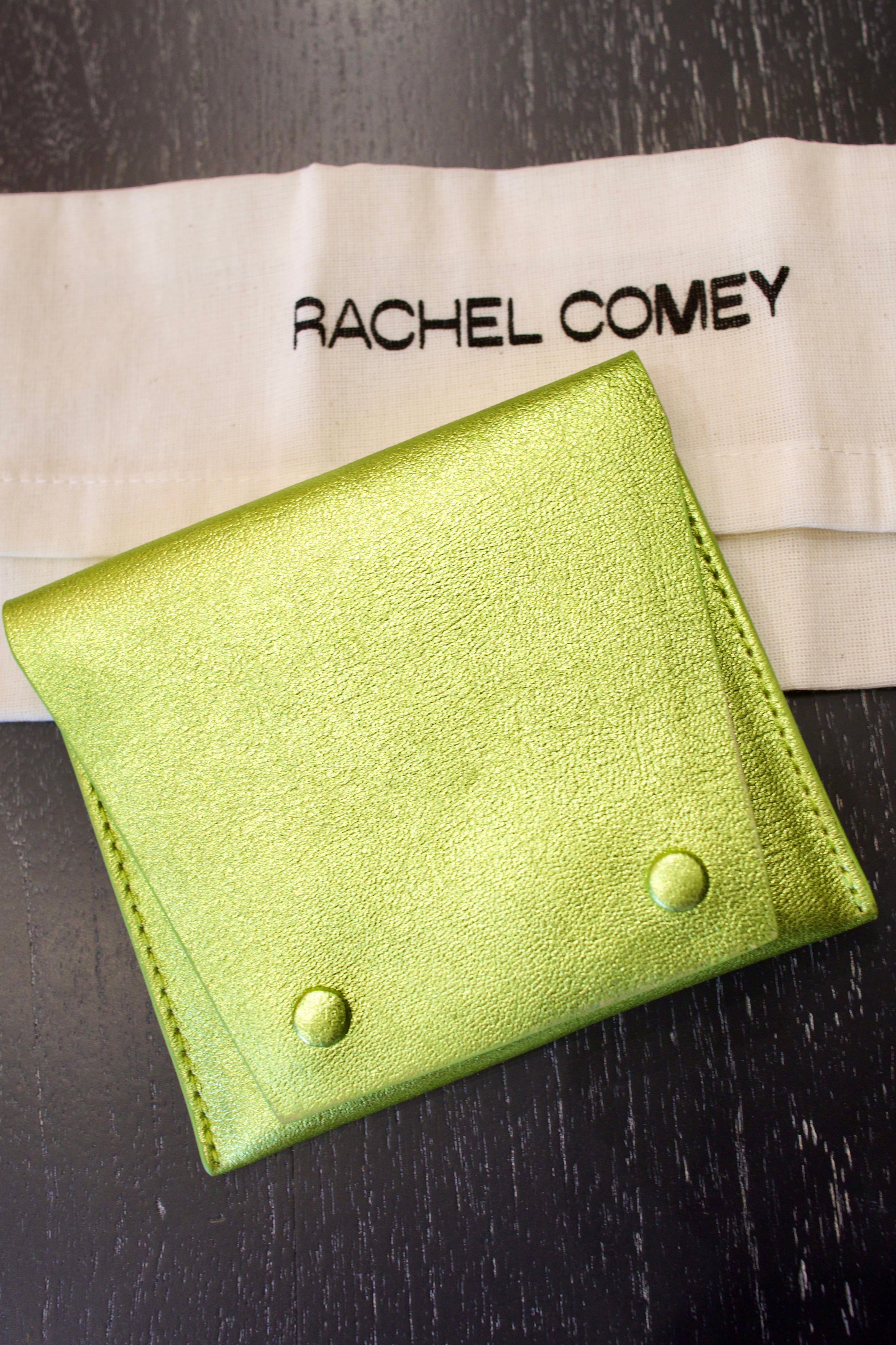 Green Rachel Comey leather wallet with two snap buttons closure