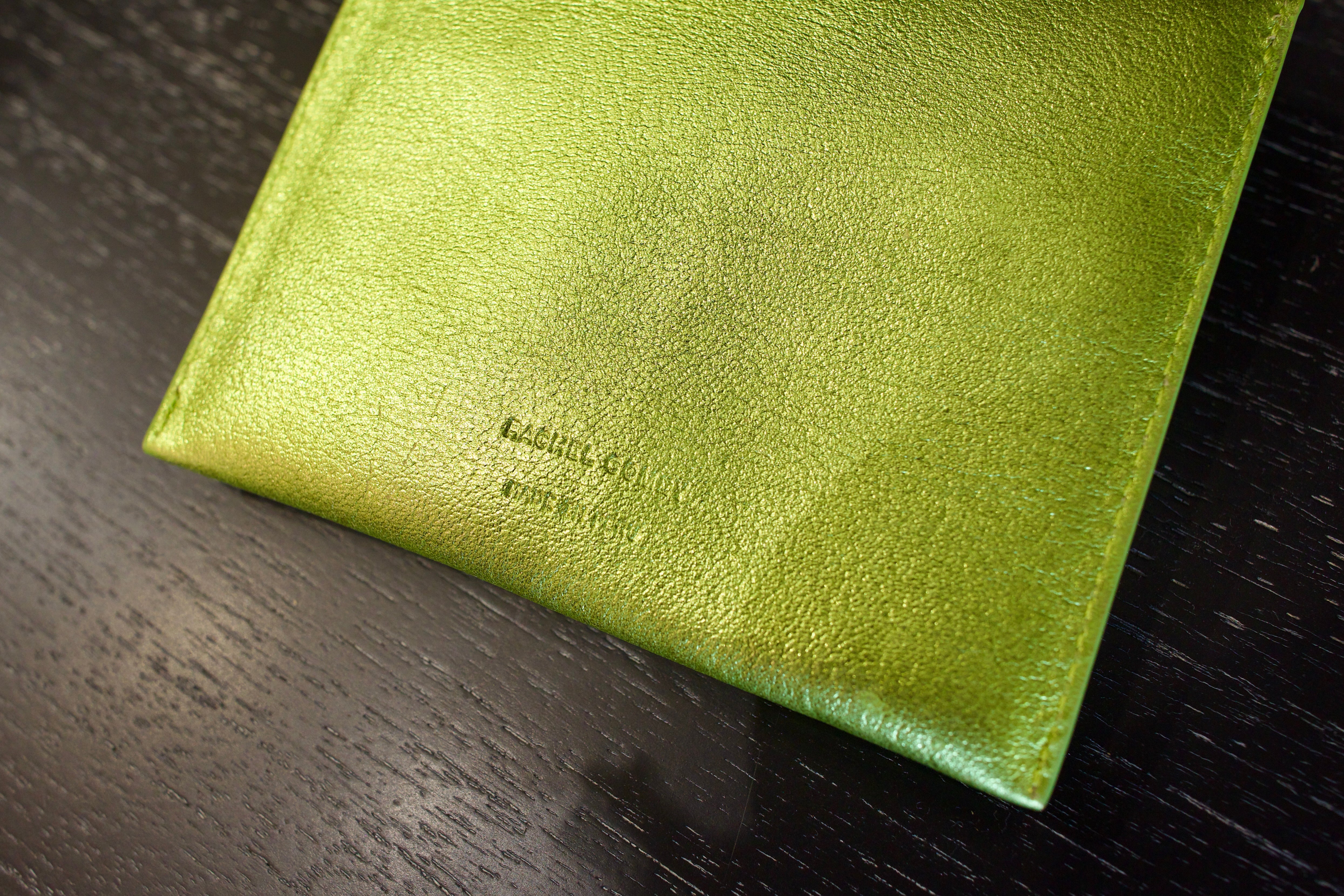Lime green Rachel Comey leather wallet with two snap buttons closure
