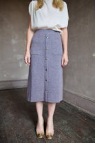 Mature model wearing a quality lilac knit skirt fabricated from baby alpaca by designer Rachel Comey