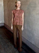 Image of woman wearing New York Designer Rachel Comey pink Brocca sweater with bronze metallic abstract pattern