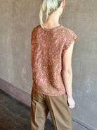 Image of woman wearing New York Designer Rachel Comey pink Brocca sweater with bronze metallic abstract pattern