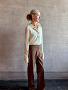 Image of woman wearing Premium Baby Alpaca Mulberry Silk Calma shirt by Rachel Comey with button front, long sleeves and button front in cream