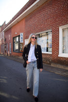 Mature woman wearing Rag and Bone Harlow denim with straight leg, mid-rise  stretch denim, ankle length jean light wash