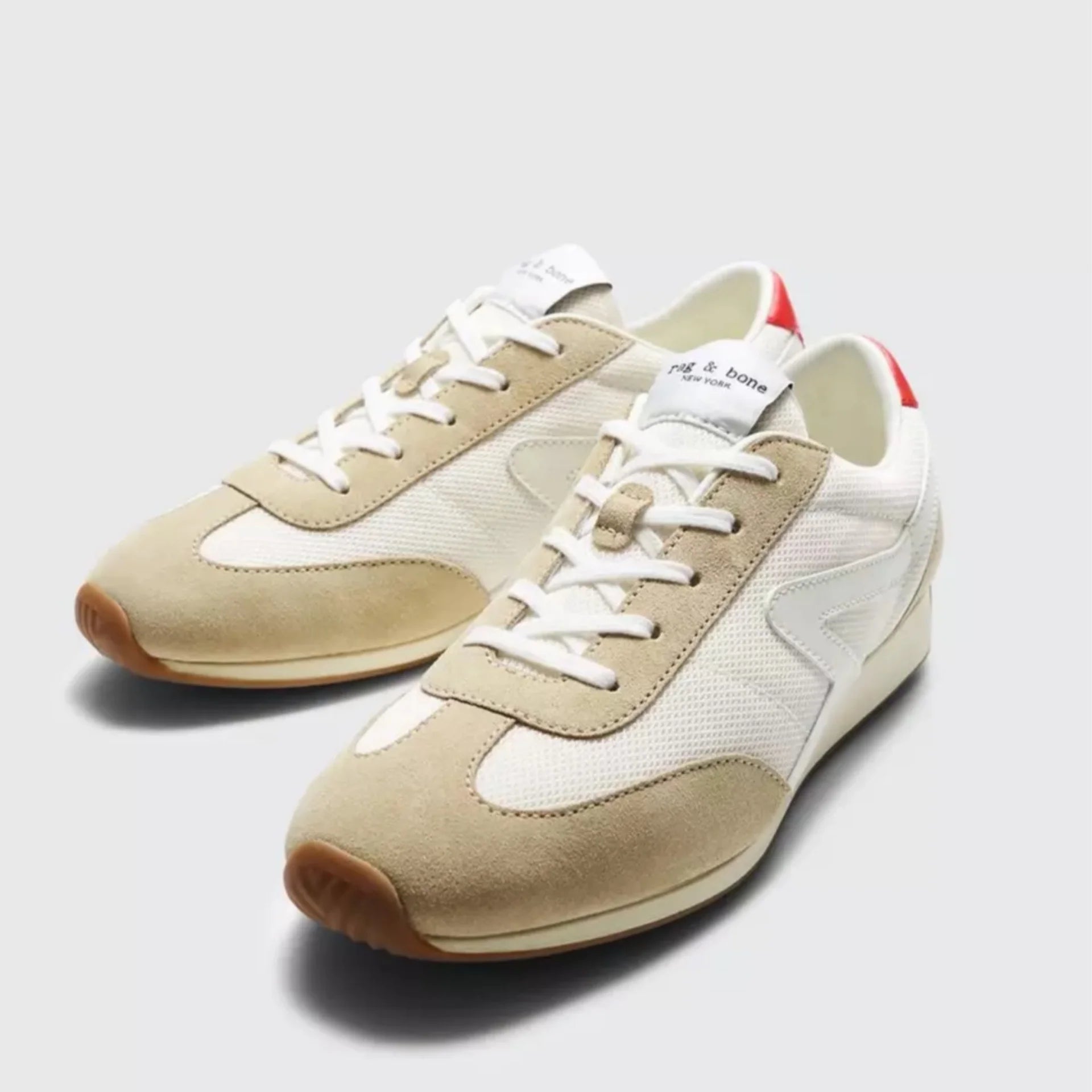 Image featuring Rag & Bone Retro Runner with an almond toe crafted with an Ortholite footbed that rebounds when you walk in white and beige with orange trim.