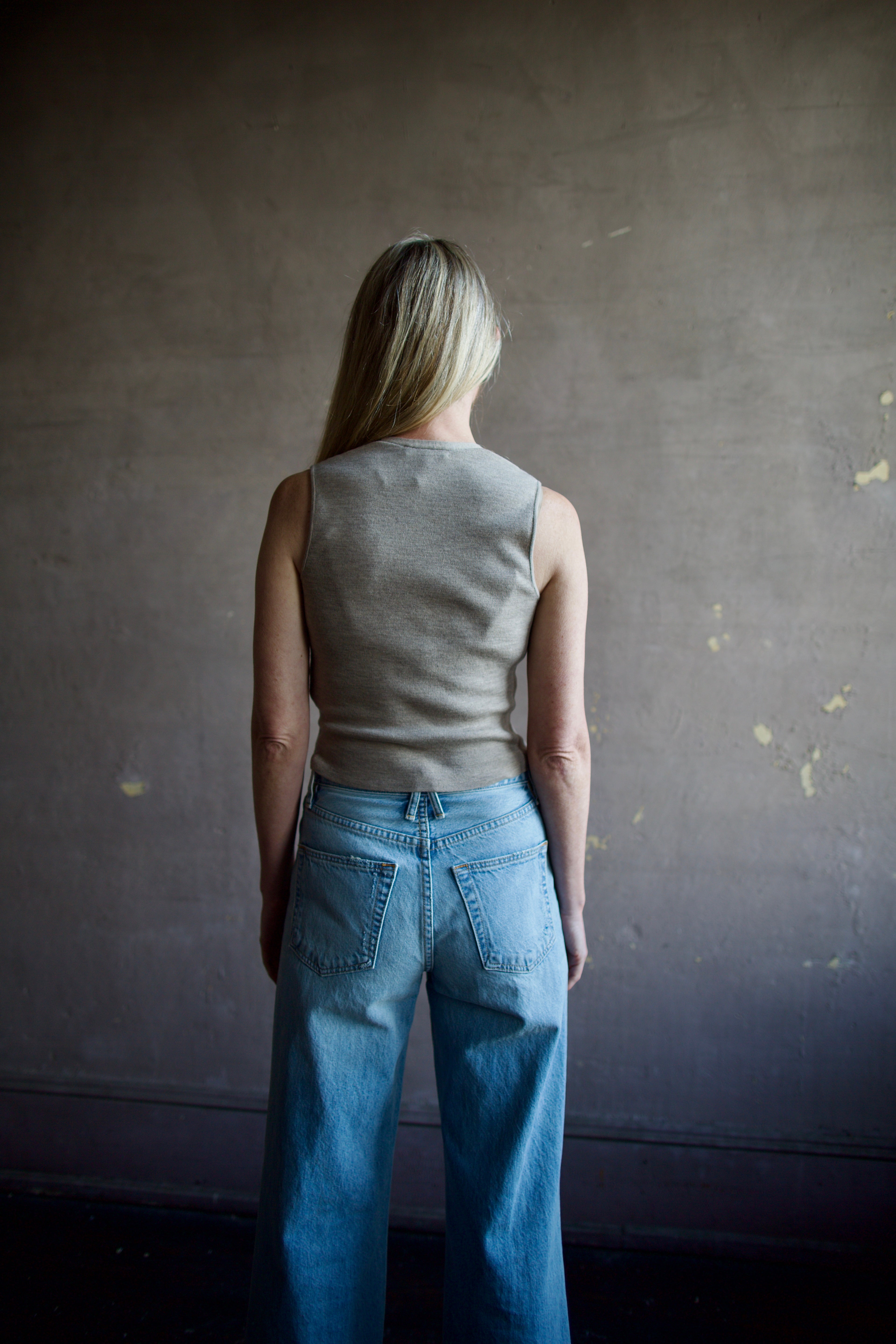 Mature woman wearing advanced contemporary Women's Rag and Bone Ella Vest in dark taupe offers a sophisticated layering in fitted knit