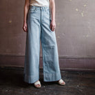 Image featuring a woman wearing the Rag & Bone Sofie denim with a cropped wide leg jean and Cuffed bottom.