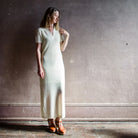 Image featuring a woman wearing the Rag & Bone Leah Knit Sheath Maxi Dress in ecru.