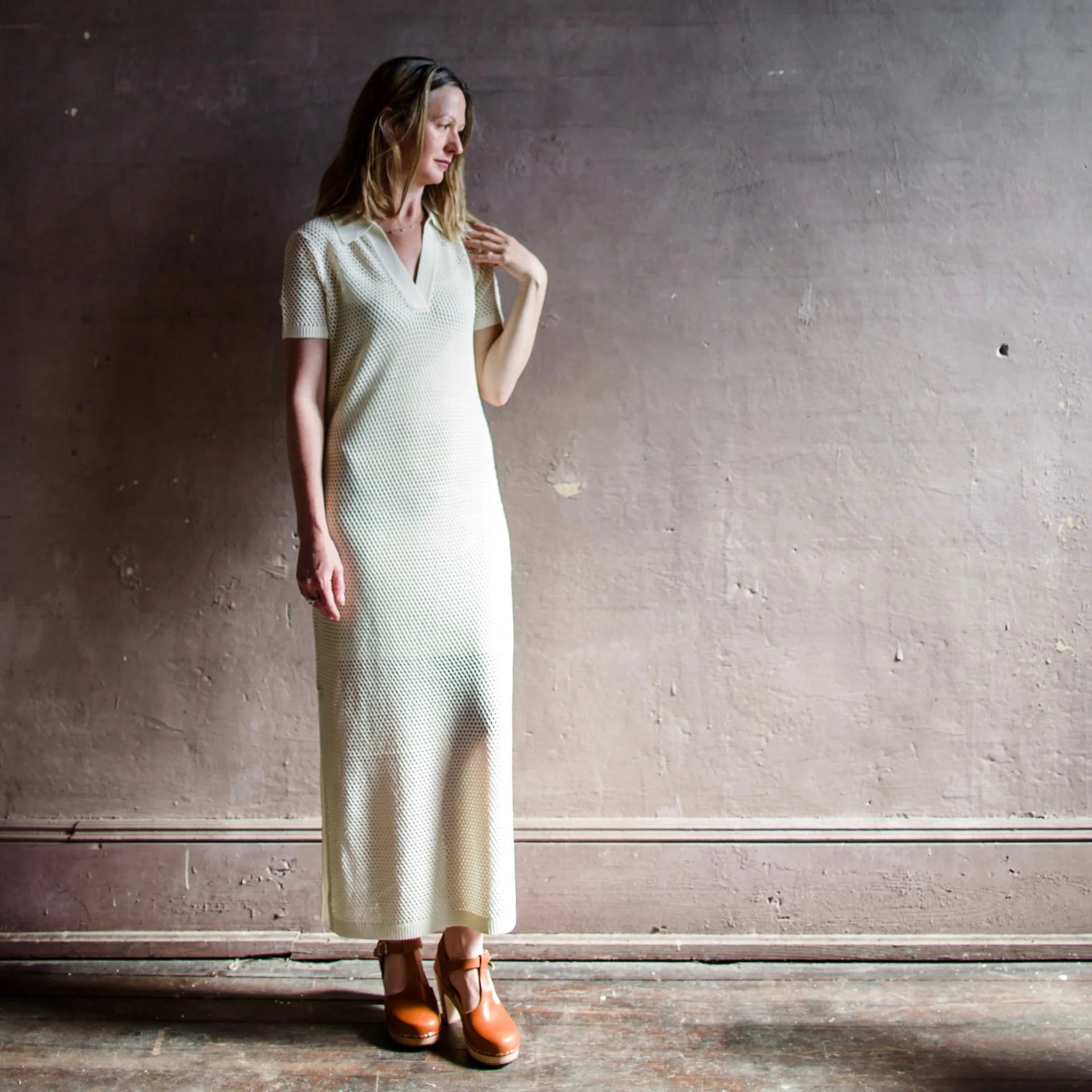 Image featuring a woman wearing the Rag & Bone Leah Knit Sheath Maxi Dress in ecru.