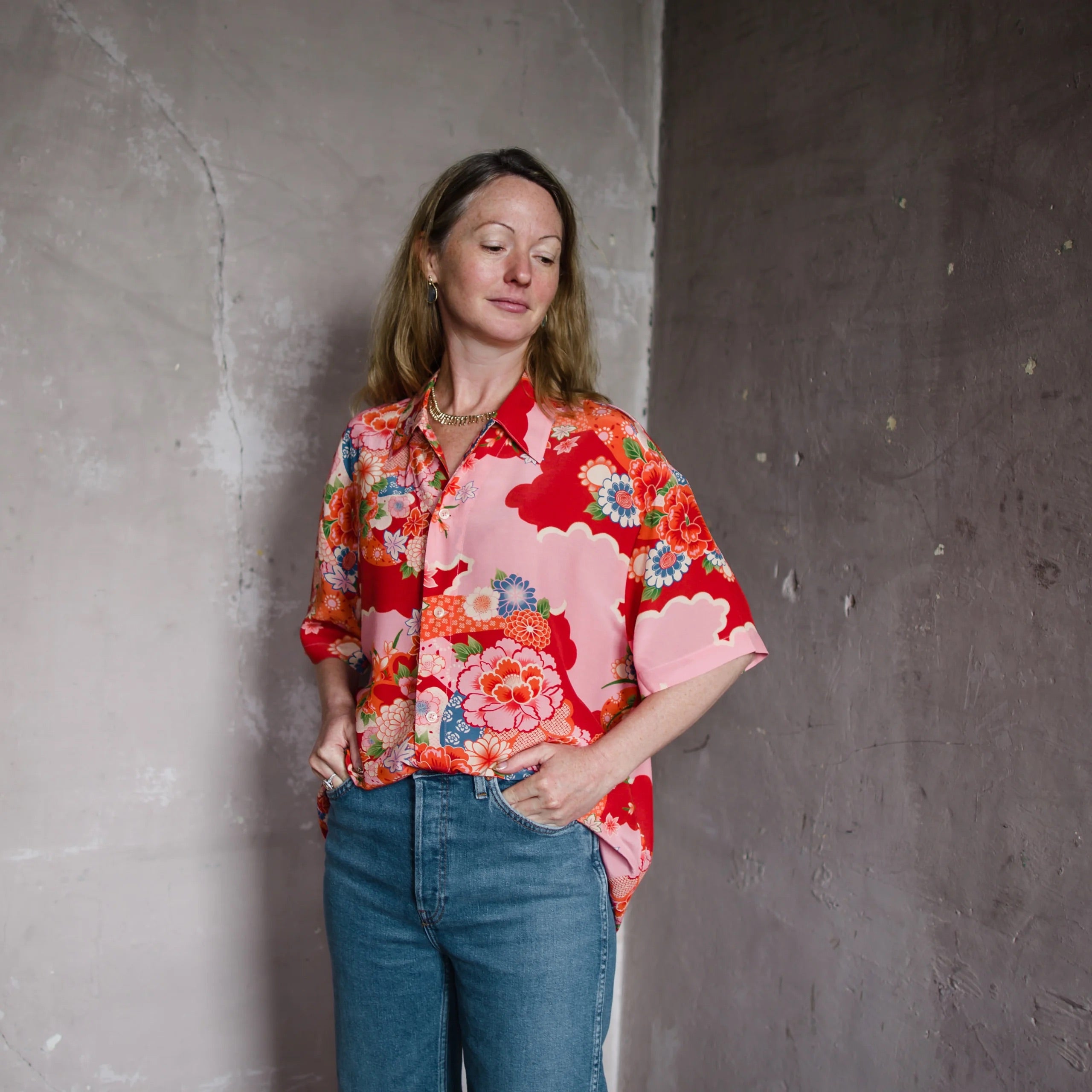 Image featuring a woman wearing Re/Done Aloha shirt with a relaxed fit in a lightweight fabric, spread collar, short sleeves and a button-front closure.