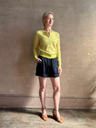 Mature woman wearing Sablyn's Brynn Silk Shorts in Navy Blue pull-on wide leg effortlessly elevated