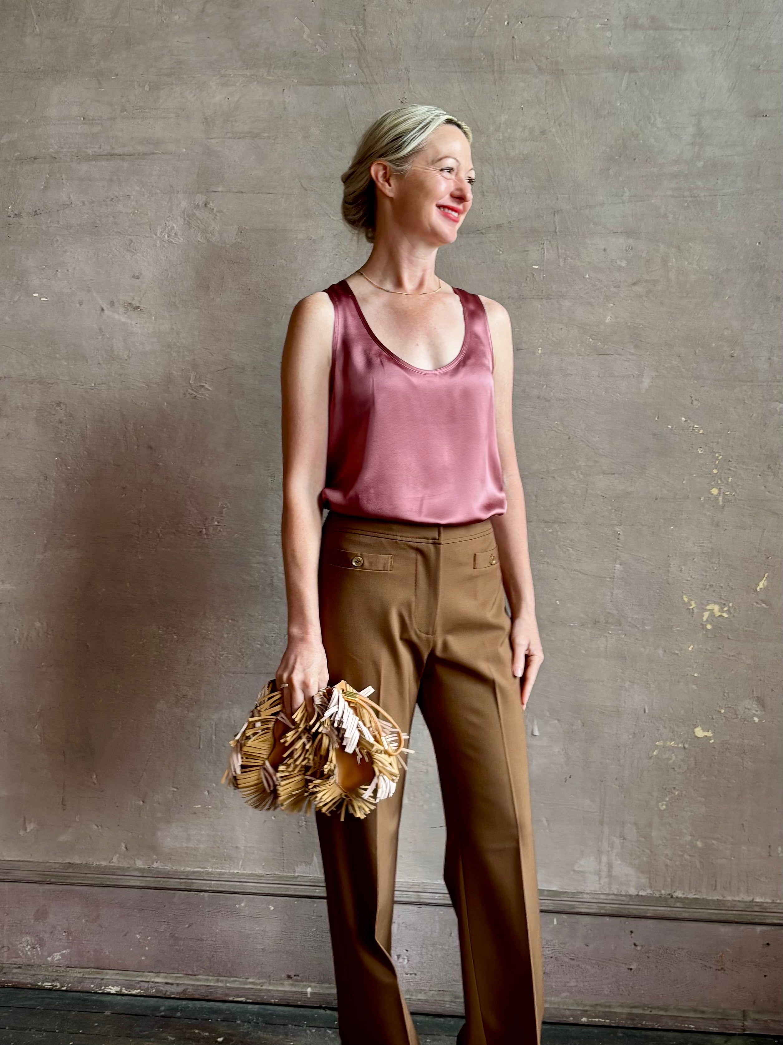 Mature woman wearing Sablyn Claudia B Scoop Neck Silk Tank in Desert Bloom flattering scoop neckline Made in the USA effortlessly elevated
