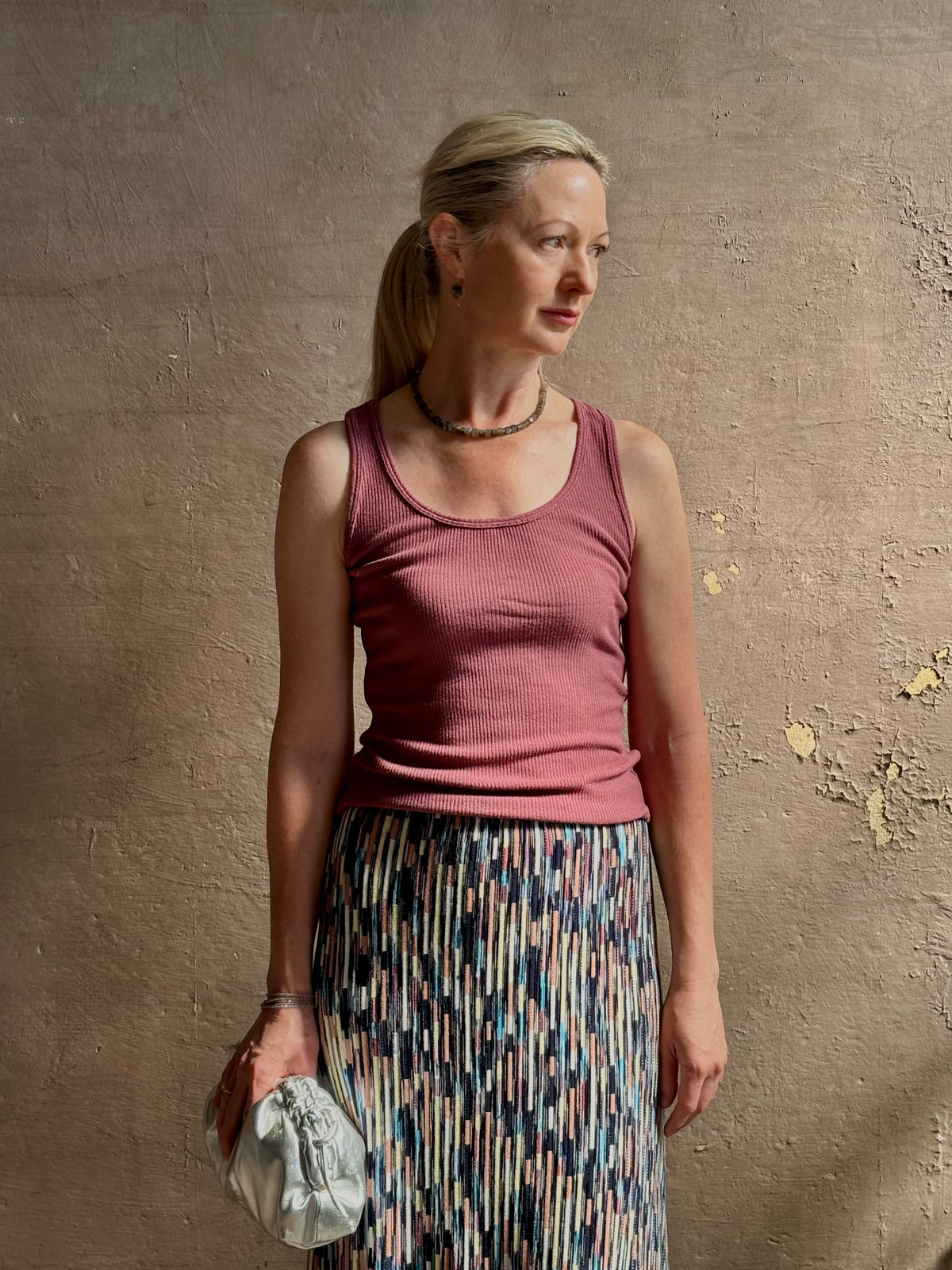 Mature woman wearing Sablyn Coco Scoop Neck Tank in Rose tailored scoop neckline Soft dusty rose layering essential