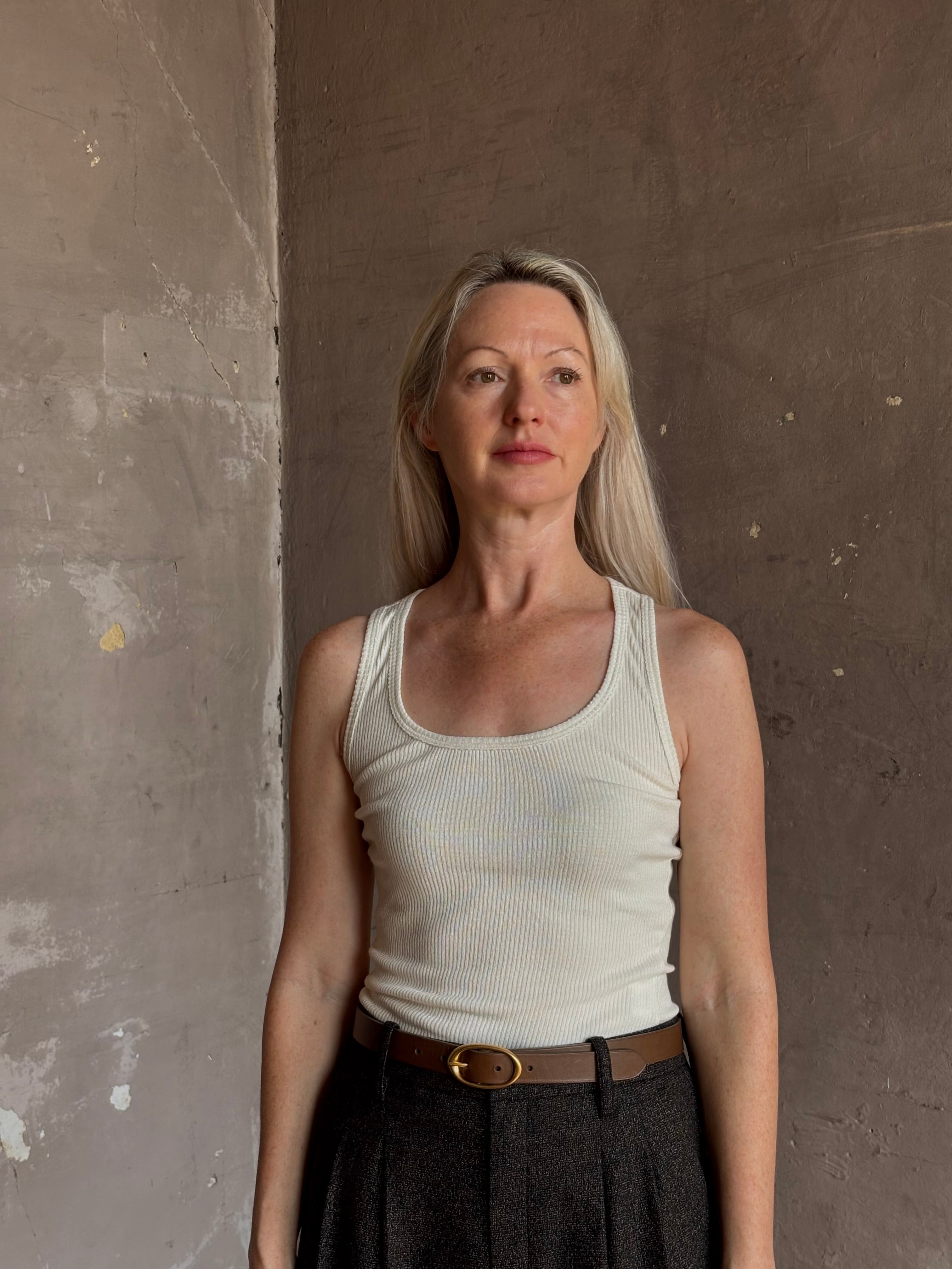 Mature woman wearing Sablyn Coco Scoop Neck cream Tank Top ribbed soft knit comfortable layering basic 