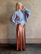 Woman wearing oversized SABLYN Wells B Cropped Pullover Sweater in Azureous Multi with drop shoulders