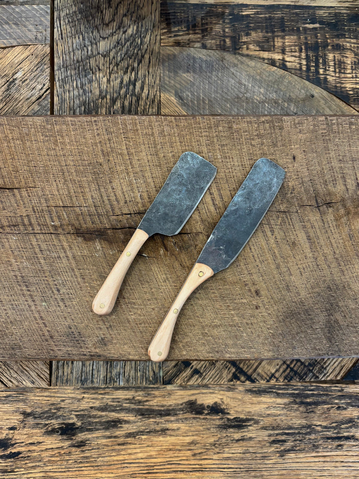 A small and large rustic modern charcuterie serving knife set with hand-forged steel blade and walnut wooden handle hand crafted in USA