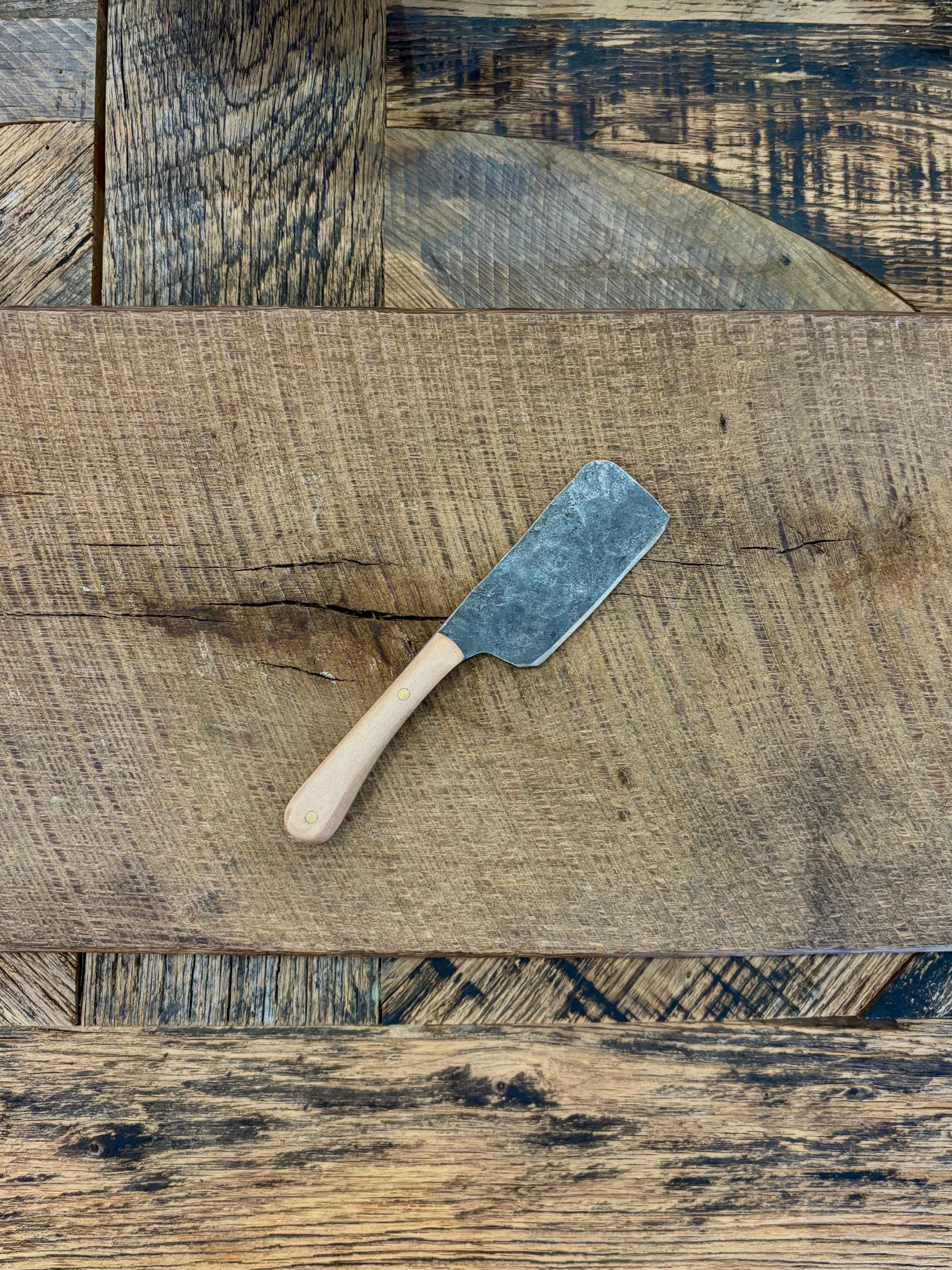 A small rustic modern charcuterie serving knife set with hand-forged steel blade and a walnut wooden handle hand crafted in USA
