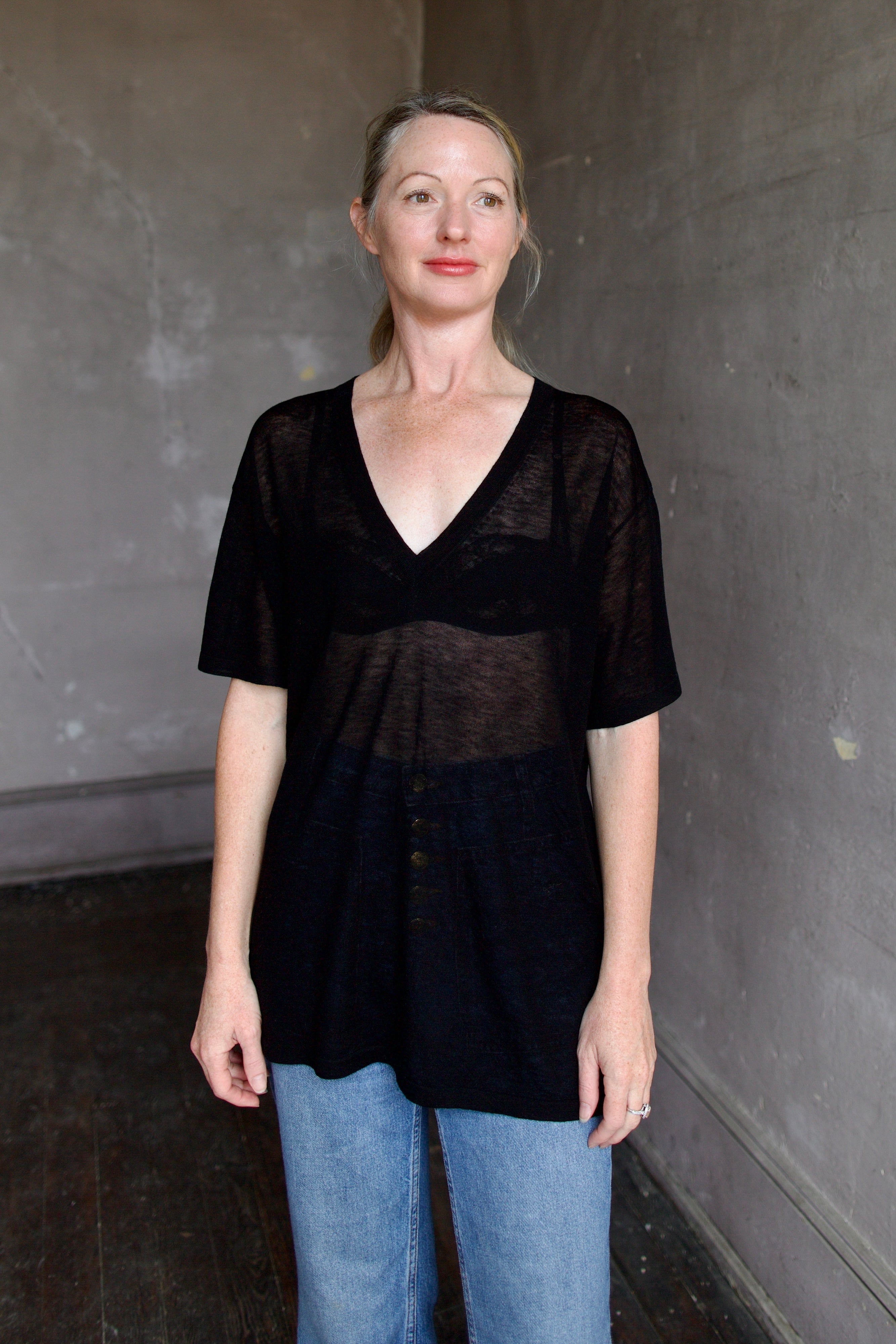 Model wearing SPRWMN Black V Neck Wool Tee - Designer Sheer Wool Short Sleeve Top