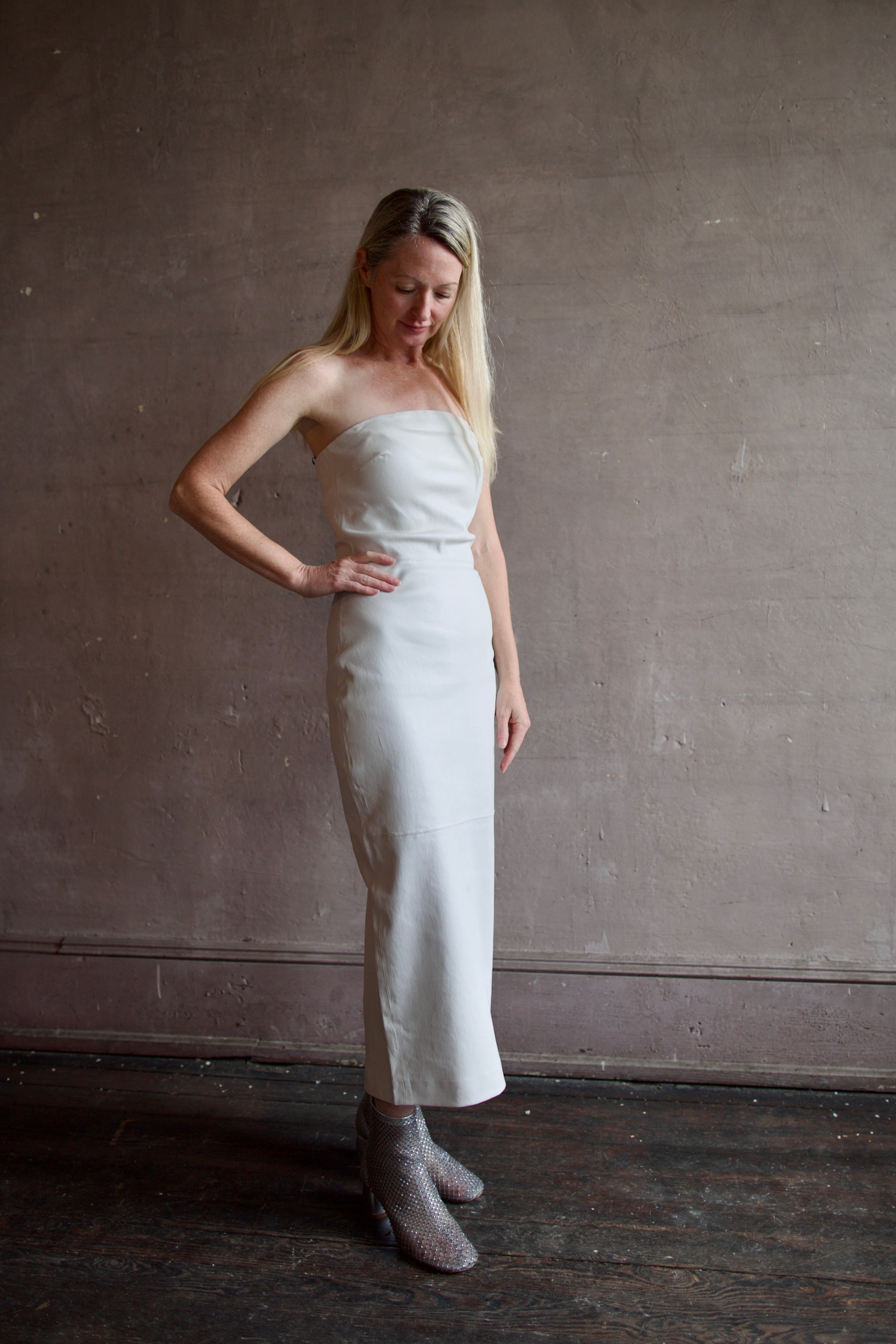 Model wearing SPRWMN Shell White Tube Dress - Designer Strapless Stretch Leather Midi