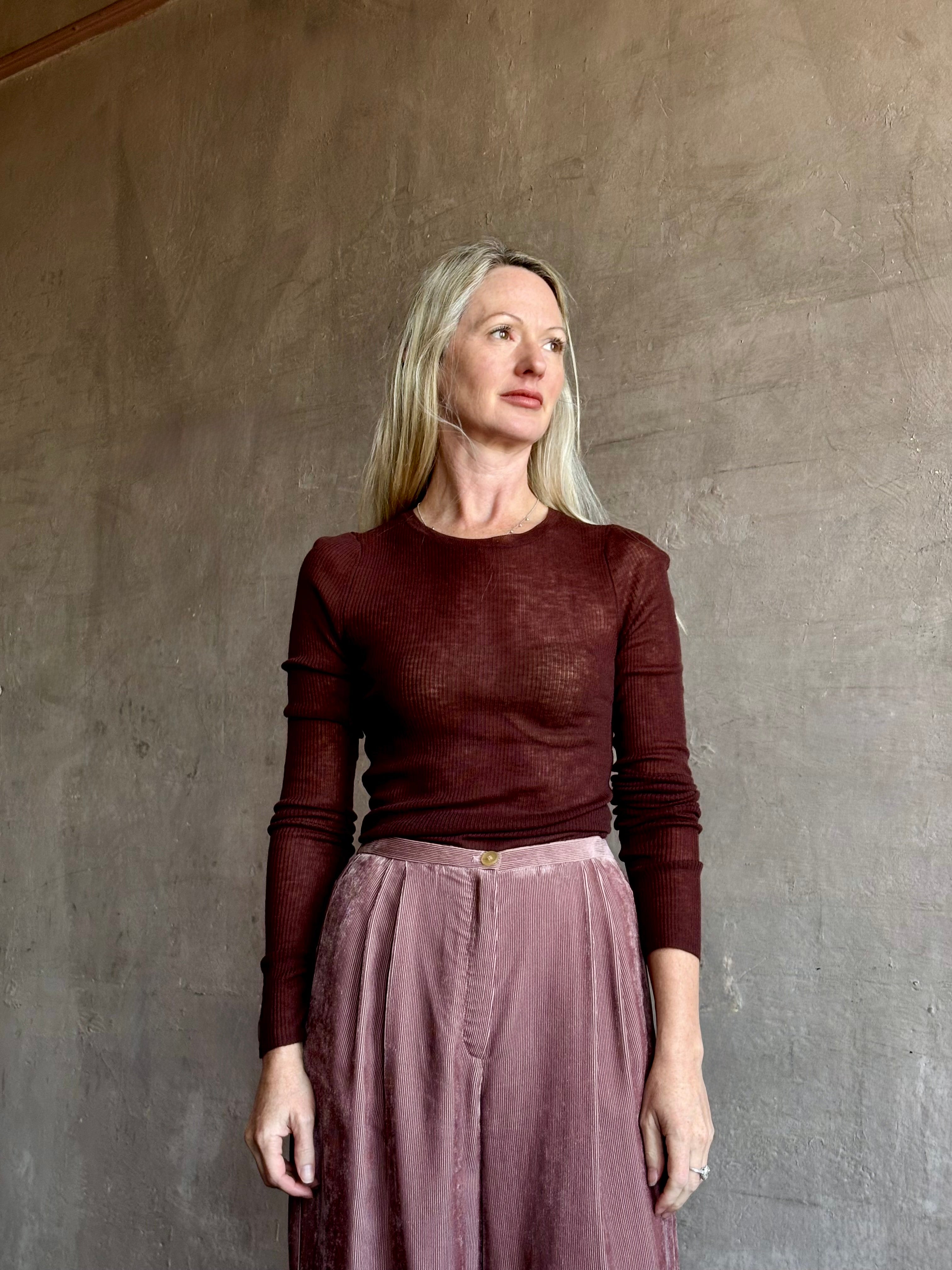 Image of mature woman wearing a lightweight long sleeve crew neck chocolate brown wool knit by SPRWMM 