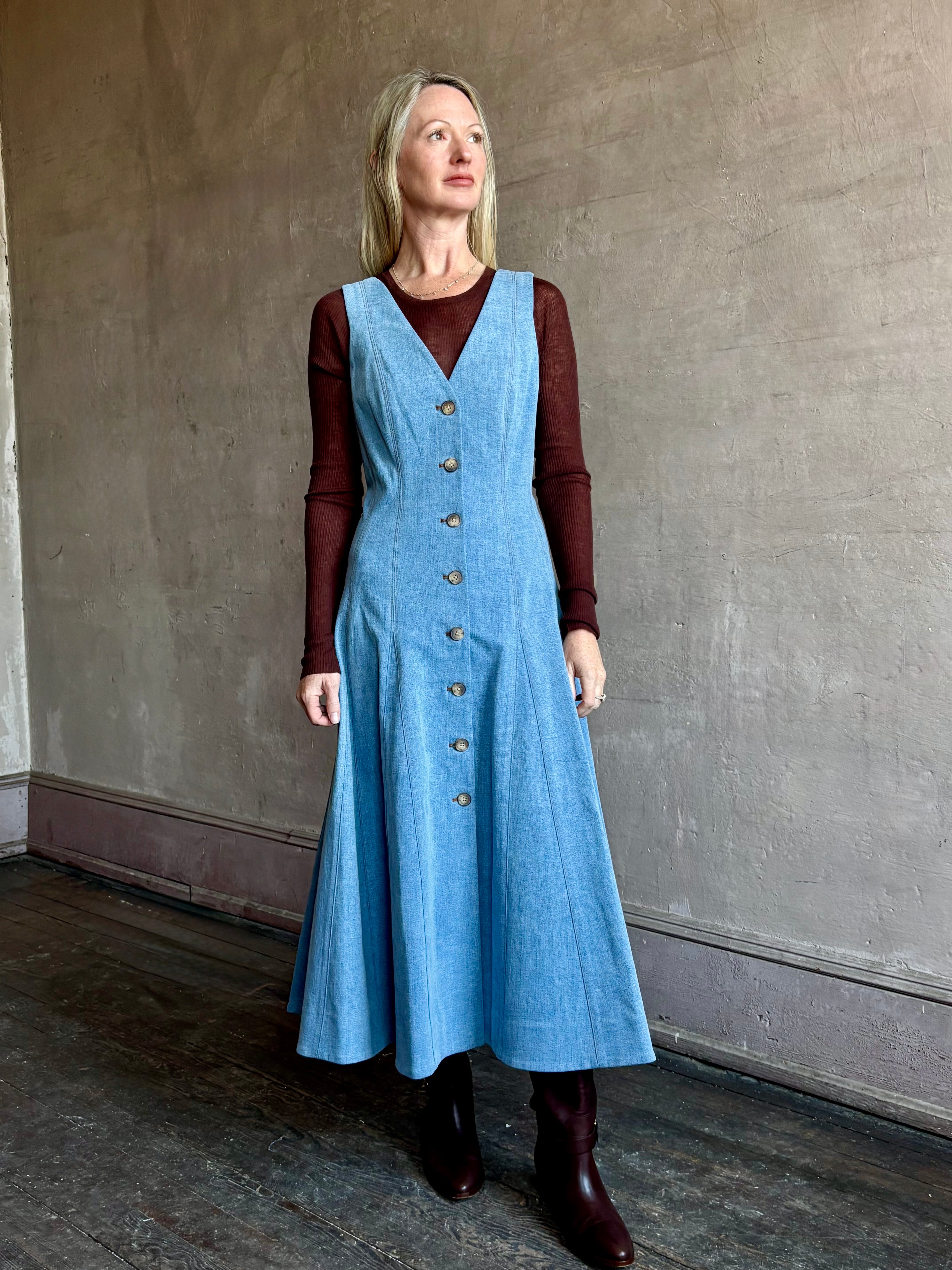 Image of mature woman wearing luxurious long sleeve layering wool top in premium brown wool knit by SPRWMM 