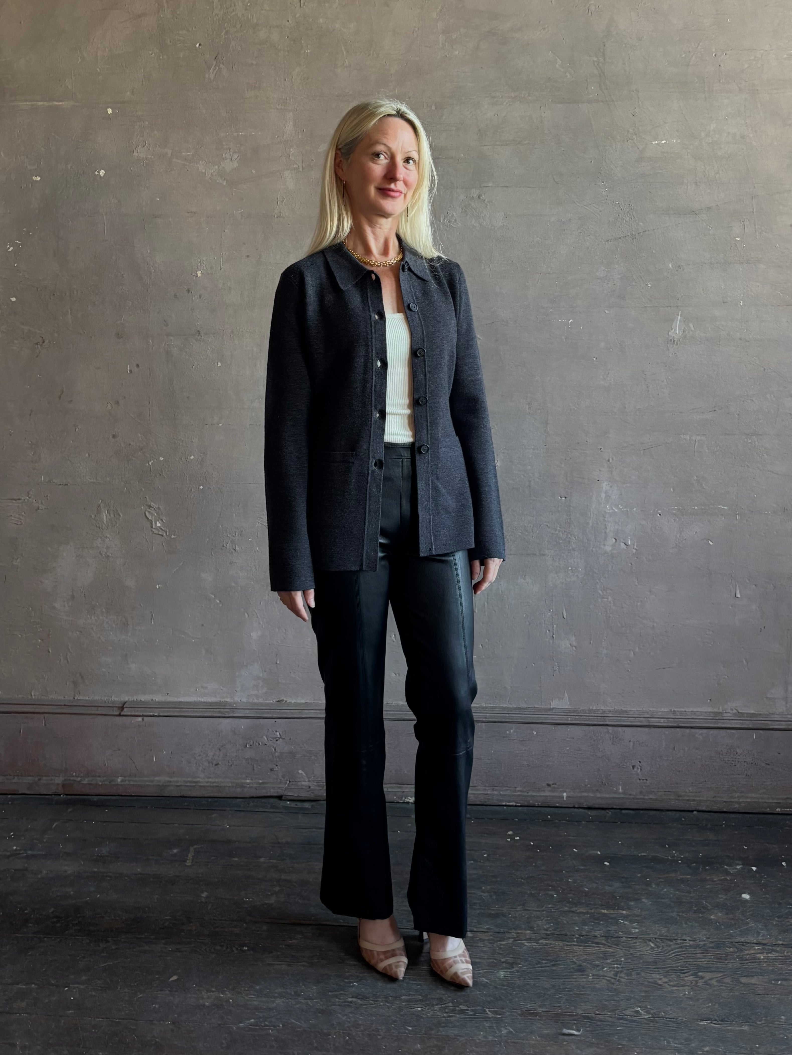 Mature woman wearing SPRWMN Black Ankle Flare Leather Pants Designer Mid-Rise Stretch Leather 
