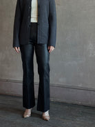 Mature woman wearing SPRWMN Black Ankle Flare Leather Pants Designer Mid-Rise Stretch Leather 