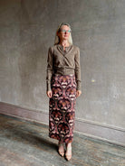 Mature woman wearing designer SPRWMN brown knit cashmere button front layering or stand alone baby cardigan 