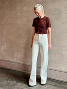 Image of woman wearing premium polished layer SPRWMN classic brown wool tee shirt with crew neck and short sleeve