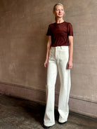 Image of woman wearing premium polished layer SPRWMN classic brown wool tee shirt with crew neck and short sleeve