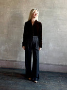 Mature woman wearing SPRWMN Elise Button Up Silk Velvet Top in Warm Brown classic collar long sleeve liquid drape Made in the USA quietly luxurious