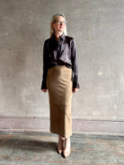 woman wearing luxury brand SPRWMN Fonda silk button up shirt in a black and brown stripe modern classic