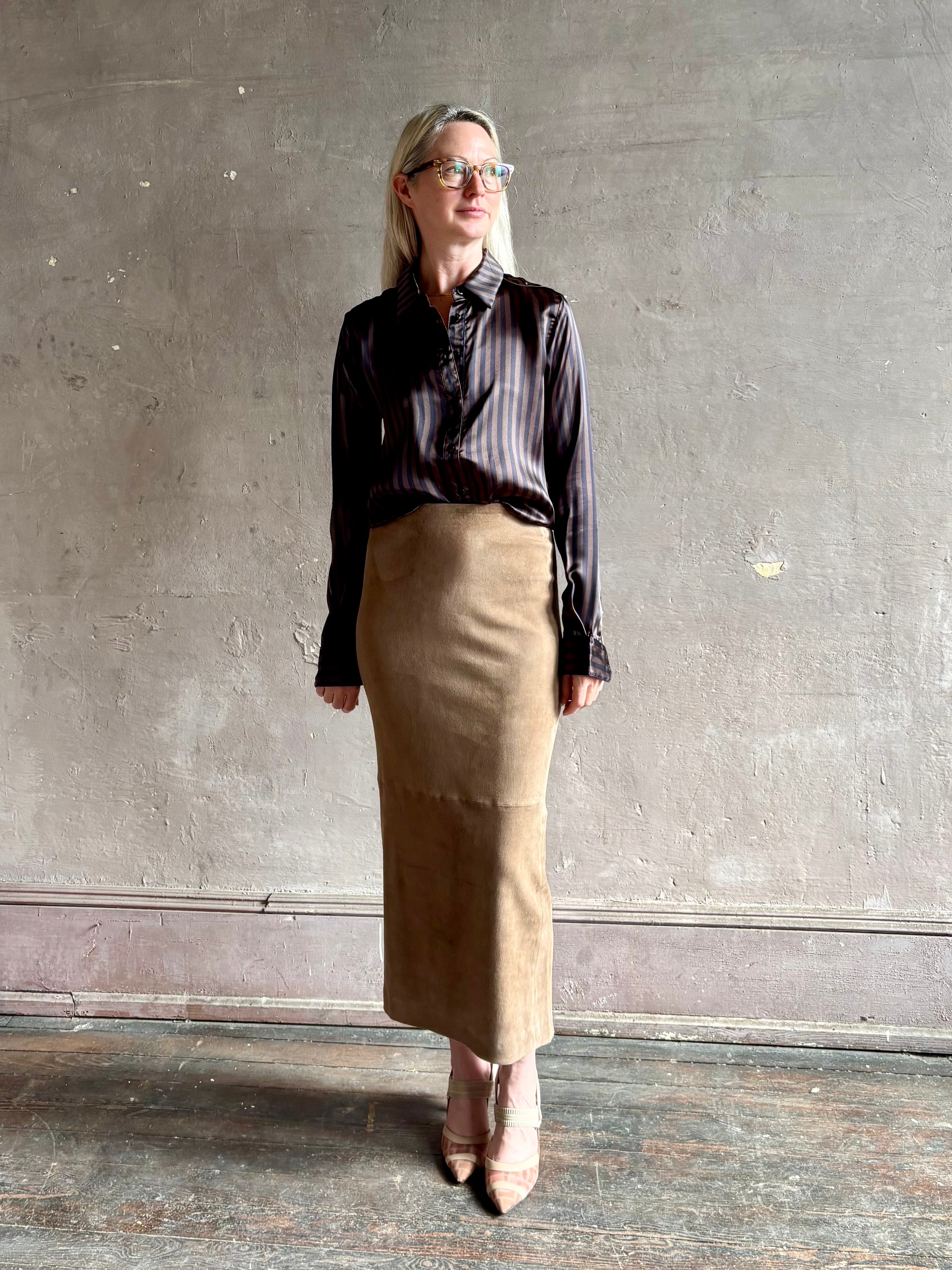 woman wearing luxury brand SPRWMN Fonda silk button up shirt in a black and brown stripe modern classic