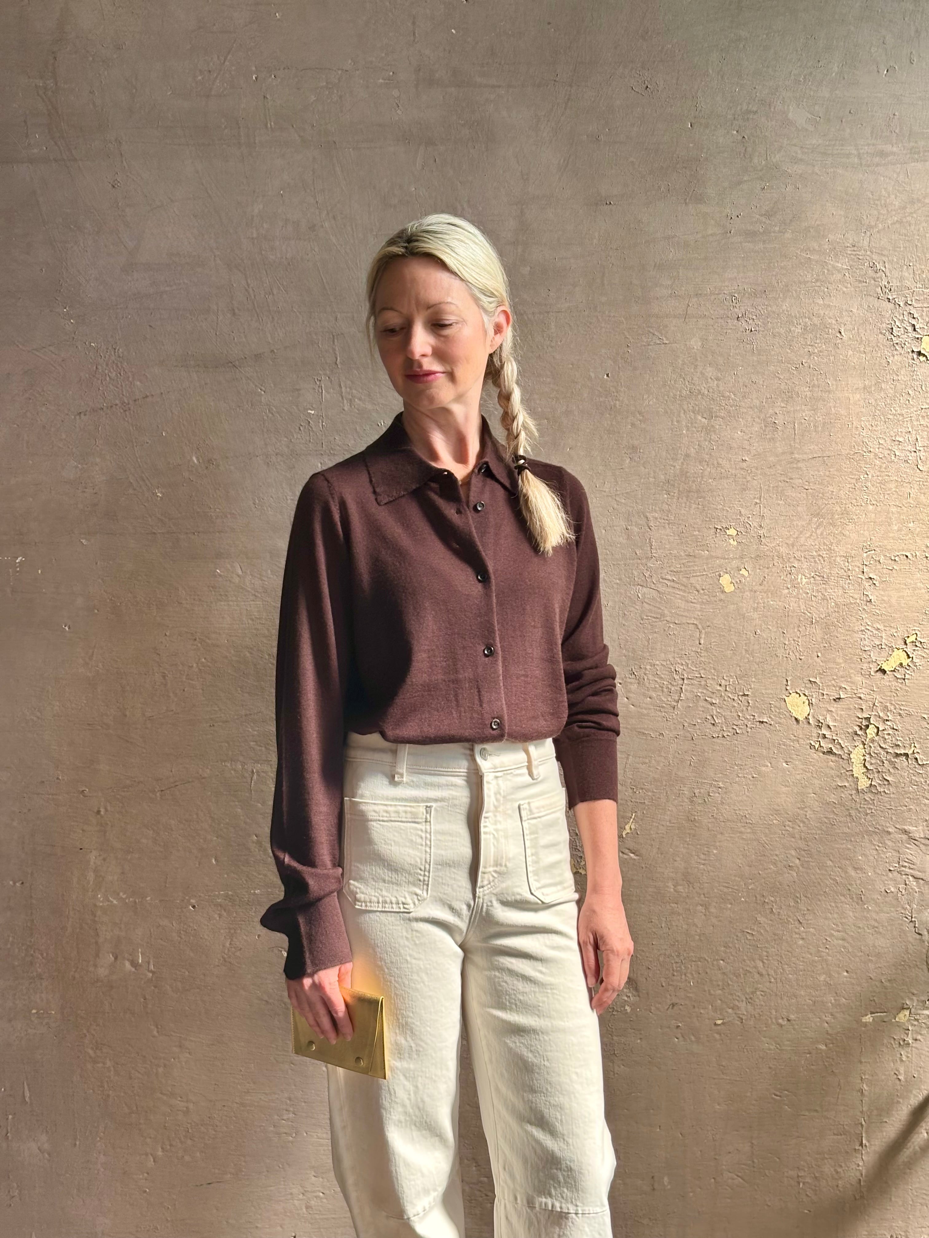 Mature woman wearing elevated casual wear button front Fonda top by SPRWMN in chocolate brown cashmere with long sleeves and a collar