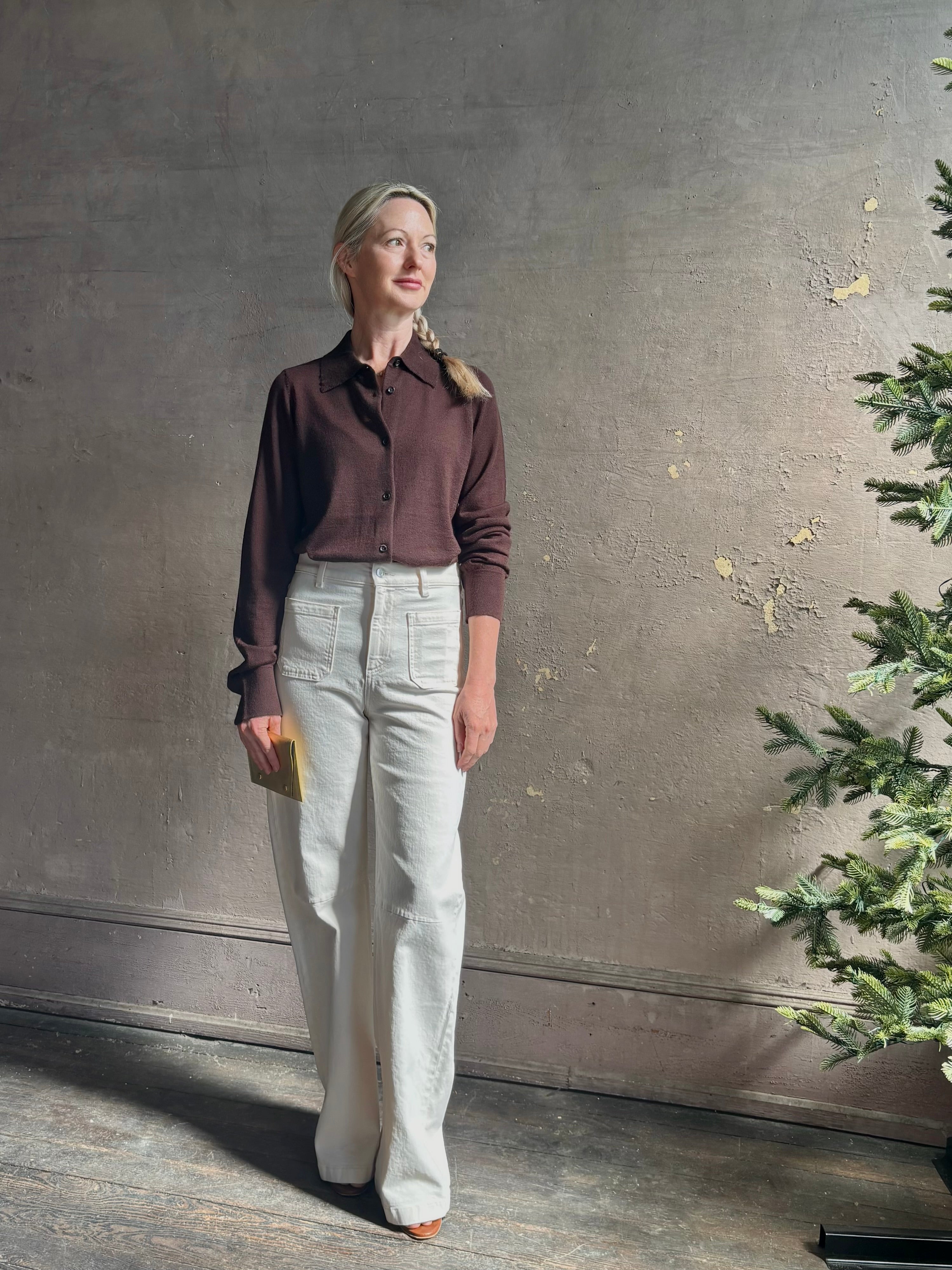 Mature woman wearing elevated casual wear button front Fonda top by SPRWMN in chocolate brown cashmere with long sleeves and a collar