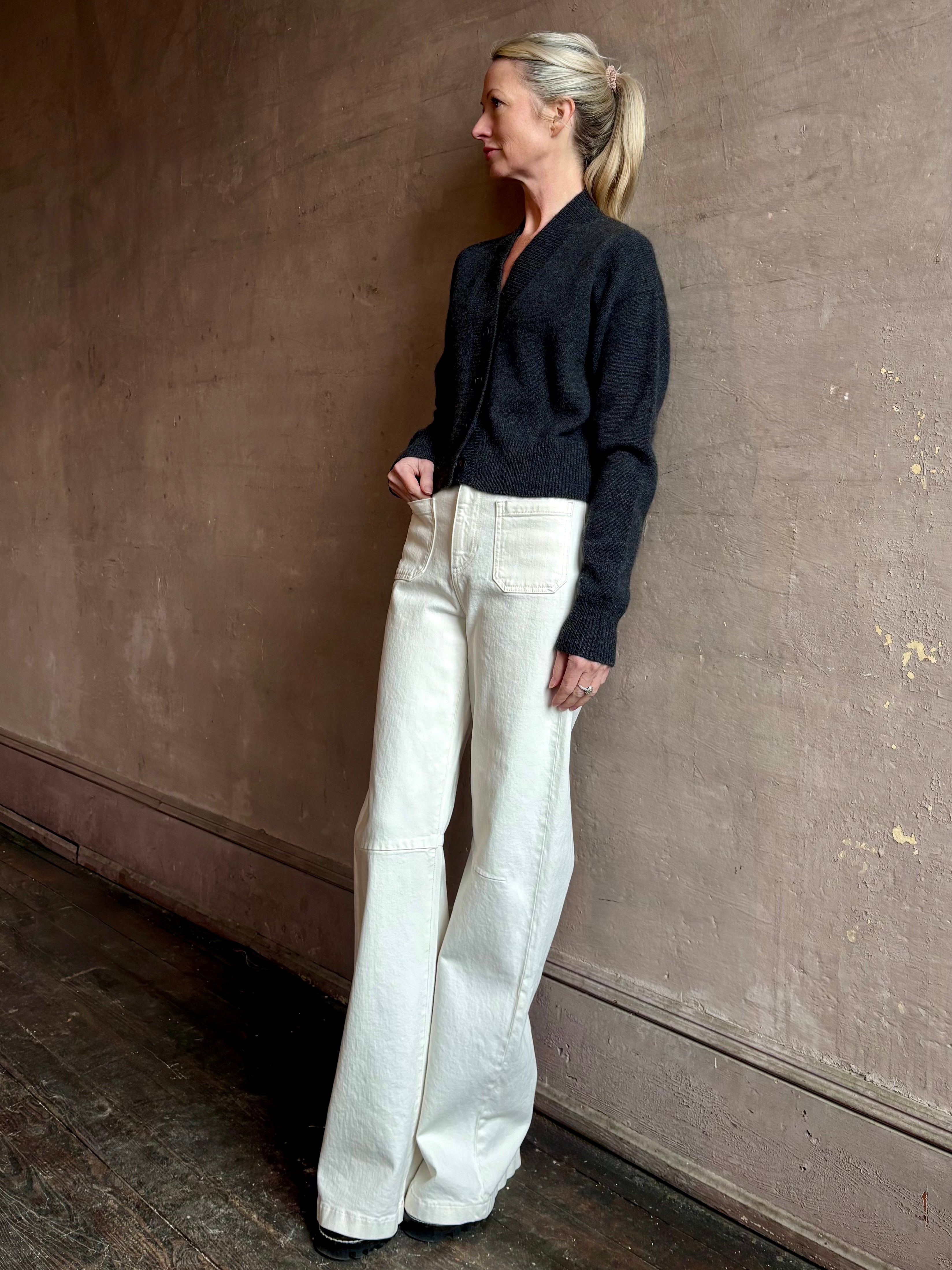 Woman wearing SPRWMN Mia luxury knitwear Cardigan that can transition from professional layering to casual comfort